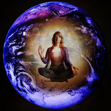 Woman Meditating Against a Globe Backdrop