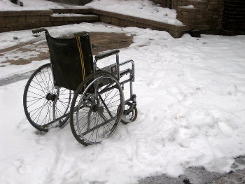 Empty wheelchair in snow